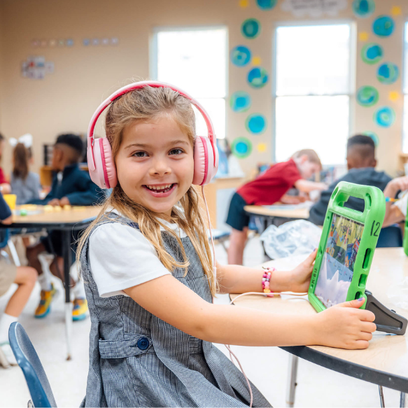 An elementary school student working with an iPad at The Dunham School in Baton Rouge, Louisiana